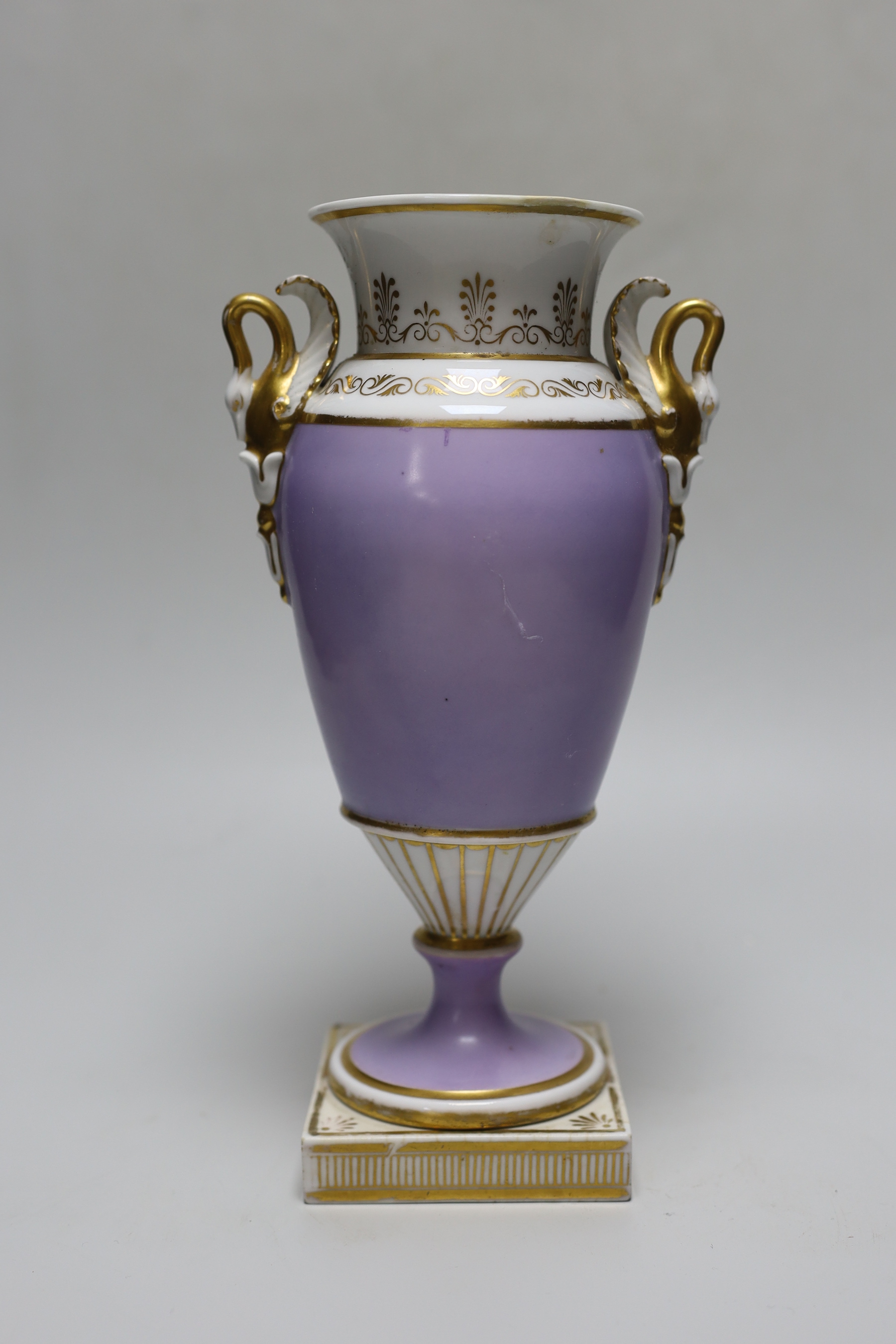 An English porcelain vase with swan handles, probably Chamberlains Worcester, painted with flowers on a lavender ground c.1820, 25.5cm tall